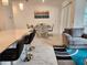 The dining room and kitchen flow into the living room to create an inviting open-concept at 1058 Splash Shot Pl, Davenport, FL 33896
