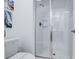 Modern bathroom with a glass-enclosed tile shower and chrome fixtures at 1058 Splash Shot Pl, Davenport, FL 33896