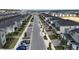 Aerial view of residential street with parked cars and sidewalks at 1058 Splash Shot Pl, Davenport, FL 33896