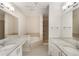 Spacious bathroom with double vanities, a soaking tub, and a separate shower at 1231 Wright Cir # 108, Kissimmee, FL 34747
