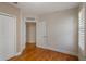 Bright bedroom featuring hardwood floors, a double door closet and plantation shutters at 1231 Wright Cir # 108, Kissimmee, FL 34747