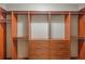 Well-organized walk-in closet with shelves, drawers, and hanging rods at 1231 Wright Cir # 108, Kissimmee, FL 34747
