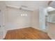 Dining room with hardwood floors, modern lighting, and neutral paint at 1231 Wright Cir # 108, Kissimmee, FL 34747