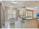 Stylish kitchen featuring granite countertops, stainless steel appliances, and bright cabinetry at 1231 Wright Cir # 108, Kissimmee, FL 34747