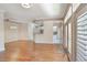 Open-concept living area with hardwood floors and access to the kitchen at 1231 Wright Cir # 108, Kissimmee, FL 34747