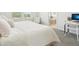 Bright bedroom with two large windows and a view of a bathroom with a tub at 12379 Turtle Grass Dr, Orlando, FL 32824