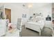 Bright bedroom featuring modern white furniture, carpet flooring, and creative decor at 12379 Turtle Grass Dr, Orlando, FL 32824