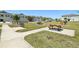 Relaxing community area featuring picnic tables, barbecue grills, and a bike rack at 12379 Turtle Grass Dr, Orlando, FL 32824