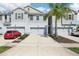 Charming townhome with an attached garage and a well-manicured lawn, perfect for suburban living at 12379 Turtle Grass Dr, Orlando, FL 32824