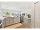 Spacious open-concept kitchen with an island, stainless steel appliances, and a view into the living area at 12379 Turtle Grass Dr, Orlando, FL 32824