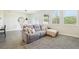 Inviting living room with a cozy sofa, well-lit by natural light and decorated with neutral tones at 12379 Turtle Grass Dr, Orlando, FL 32824