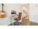 Office space with hardwood floors, a modern desk setup, and natural light at 12379 Turtle Grass Dr, Orlando, FL 32824