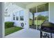 Covered patio with concrete flooring featuring a grill and a sliding glass door leading to the house at 12379 Turtle Grass Dr, Orlando, FL 32824