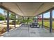Shaded picnic area with tables, adjacent to a playground for community enjoyment at 12379 Turtle Grass Dr, Orlando, FL 32824