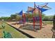 Colorful playground featuring slides, climbing structures, and shade covers for sunny days at 12379 Turtle Grass Dr, Orlando, FL 32824