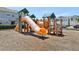 Community playground featuring slides and climbing structures for enjoyment at 12379 Turtle Grass Dr, Orlando, FL 32824