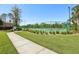 Well-maintained tennis court surrounded by lush landscaping and fencing at 12379 Turtle Grass Dr, Orlando, FL 32824