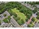 Aerial view of community green space surrounded by residential homes and trees at 1303 Artisan E Ave, Celebration, FL 34747