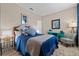 Tastefully decorated bedroom with stylish furniture, a blue color scheme, and a serene atmosphere at 1303 Artisan E Ave, Celebration, FL 34747
