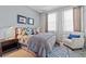 Cozy bedroom featuring neutral tones, comfortable bedding, and ample natural light at 1303 Artisan E Ave, Celebration, FL 34747