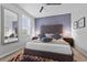Bedroom featuring a tufted headboard, mirrored wall, and a colorful rug at 1303 Artisan E Ave, Celebration, FL 34747