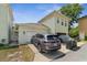 Home exterior view, showing a two-car garage and front yard at 1303 Artisan E Ave, Celebration, FL 34747