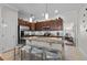Kitchen with granite countertops, stainless steel appliances, a breakfast bar, and tile flooring at 1303 Artisan E Ave, Celebration, FL 34747
