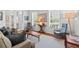 Inviting living room featuring stylish furniture, neutral walls, bright windows, and hardwood floors at 1303 Artisan E Ave, Celebration, FL 34747