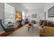 Bright living room features stylish furniture, neutral walls, bright windows and hardwood floors at 1303 Artisan E Ave, Celebration, FL 34747