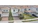 An aerial view of a two-story home with a tile roof, manicured lawn, and attached two-car garage at 13282 Bromborough Dr, Orlando, FL 32832