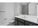 Bathroom featuring a vanity with dark cabinets, white countertop and brushed nickel faucet at 13282 Bromborough Dr, Orlando, FL 32832
