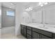 Bathroom featuring a double vanity, large mirror, and a shower/tub combination at 13282 Bromborough Dr, Orlando, FL 32832