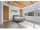 Bedroom featuring a wood beam ceiling, wood accent walls and lots of natural light at 13282 Bromborough Dr, Orlando, FL 32832