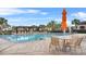 The community pool offers ample seating, shade, and a refreshing atmosphere for relaxation and leisure at 13282 Bromborough Dr, Orlando, FL 32832