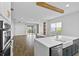Spacious, open-concept kitchen featuring a large island and wood-look floors at 13282 Bromborough Dr, Orlando, FL 32832