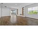 Living room featuring a fireplace, a large window and a sliding glass door to the backyard at 13282 Bromborough Dr, Orlando, FL 32832