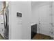 Mud room featuring a door to the exterior, a modern control panel and views of the kitchen at 13282 Bromborough Dr, Orlando, FL 32832