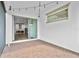 Covered outdoor patio featuring brick flooring and a view of the kitchen through sliding glass doors at 13282 Bromborough Dr, Orlando, FL 32832