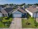 Overhead view of a one-story home in a quiet community, featuring a well-manicured lawn and landscaping at 1379 Winter Gray Cir, Deltona, FL 32738
