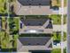An aerial view showing the layout of the homes, landscaping, and solar panels on the roof at 1379 Winter Gray Cir, Deltona, FL 32738