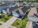 High aerial of house showing lawn, roof, landscaping in well-maintained neighborhood at 1379 Winter Gray Cir, Deltona, FL 32738