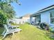 Spacious backyard features well-manicured lawn, landscaped border, and patio at 1379 Winter Gray Cir, Deltona, FL 32738