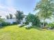 Lush backyard features well-manicured lawn, landscaped border, and lounge chairs at 1379 Winter Gray Cir, Deltona, FL 32738