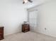 Neutral bedroom with carpet, dresser, window with sheer curtains, and light fixture at 1379 Winter Gray Cir, Deltona, FL 32738