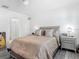 Comfortable bedroom with decorative pillows, complemented by elegant nightstands, lighting, and ensuite bathroom at 1379 Winter Gray Cir, Deltona, FL 32738