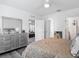 Serene bedroom featuring a stylish dresser and decor, with views into additional rooms creating an open feel at 1379 Winter Gray Cir, Deltona, FL 32738