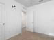 Spare bedroom with neutral carpet, white walls, white doors and trim, and neutral carpet at 1379 Winter Gray Cir, Deltona, FL 32738