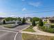 Landscaped entrance to the community with signage and well-maintained greenery at 1379 Winter Gray Cir, Deltona, FL 32738