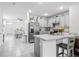 Bright kitchen with stainless steel appliances, tiled floors, and easy access to the dining room at 1379 Winter Gray Cir, Deltona, FL 32738