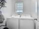 Functional laundry room with side-by-side washer and dryer units for convenient laundry care at 1379 Winter Gray Cir, Deltona, FL 32738